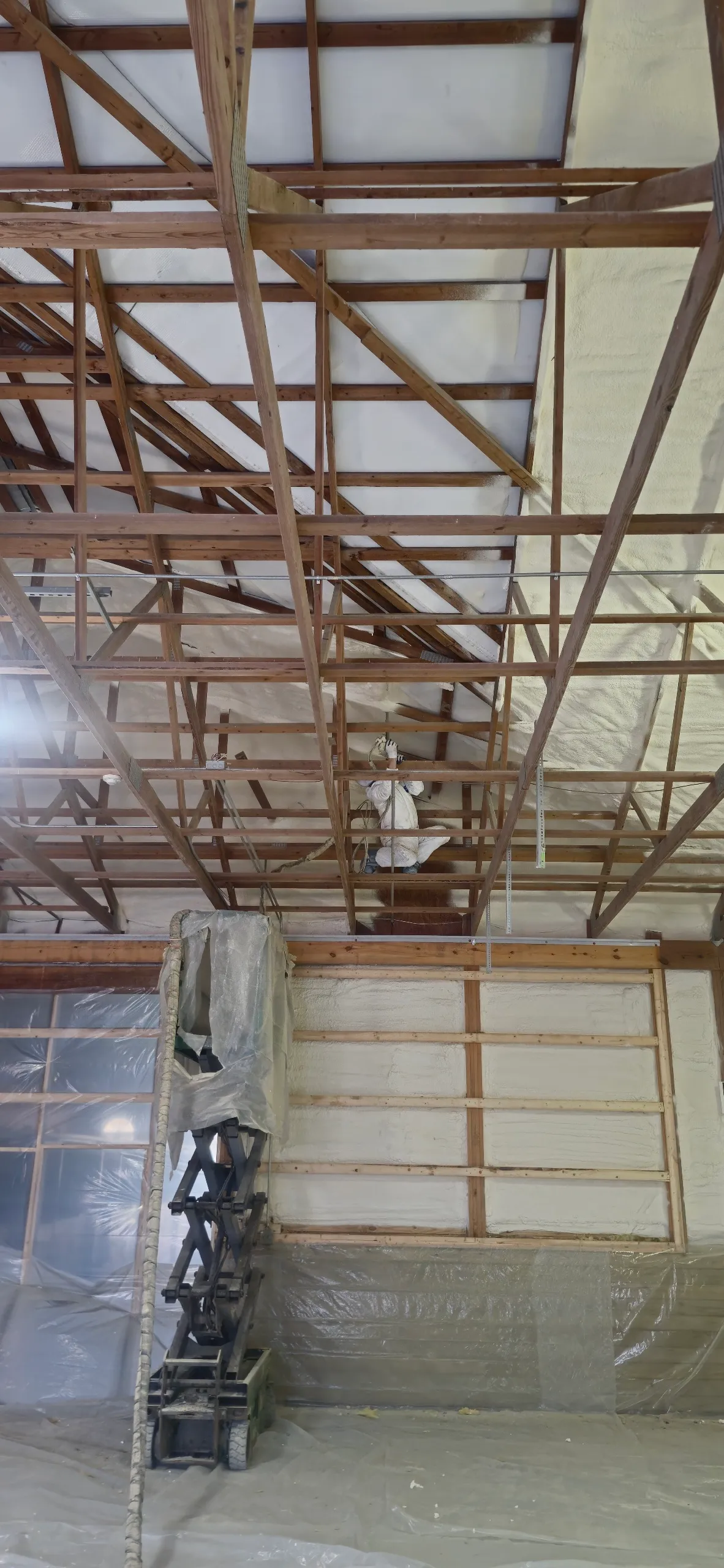 Pole barn gable end with spray foam on trusses