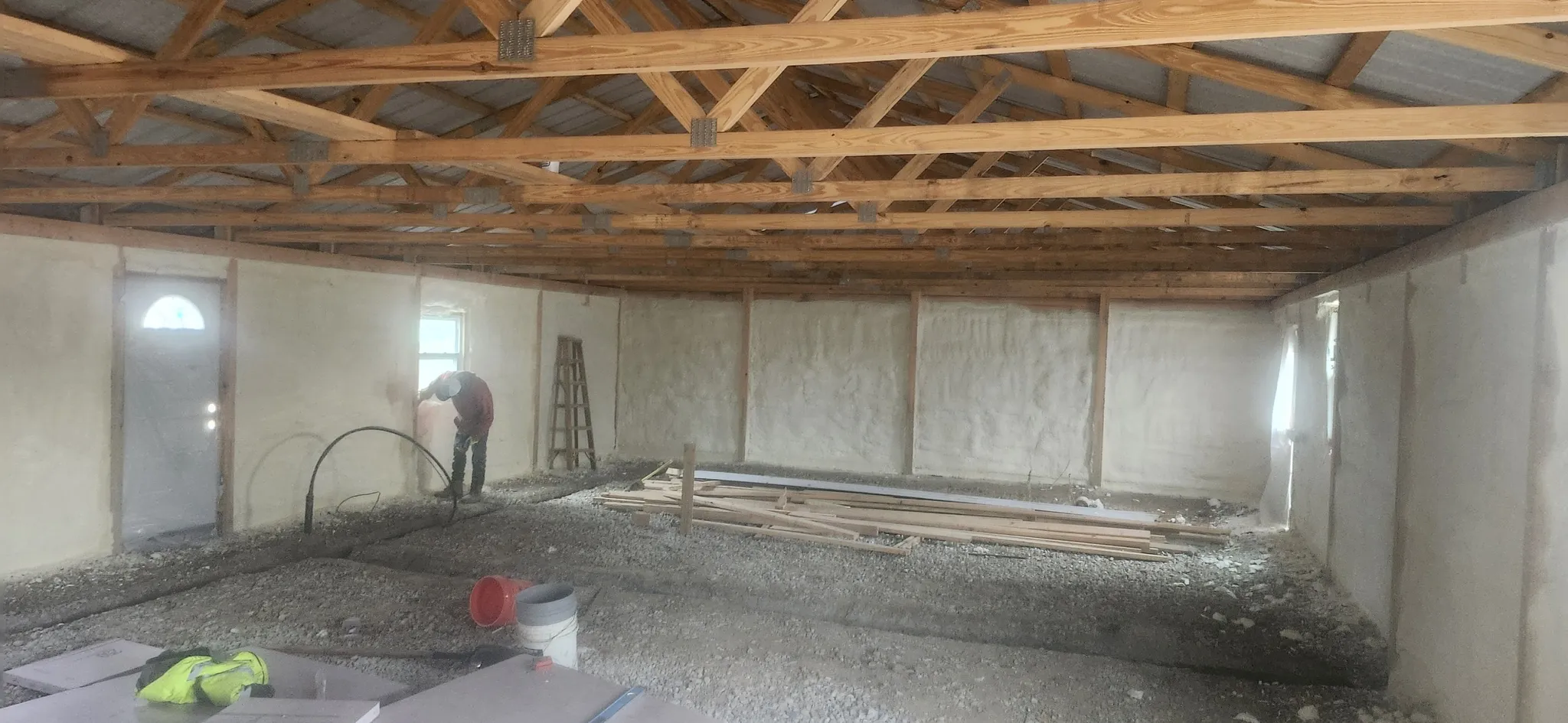 Pole barn interior with spray foam insulation on all walls